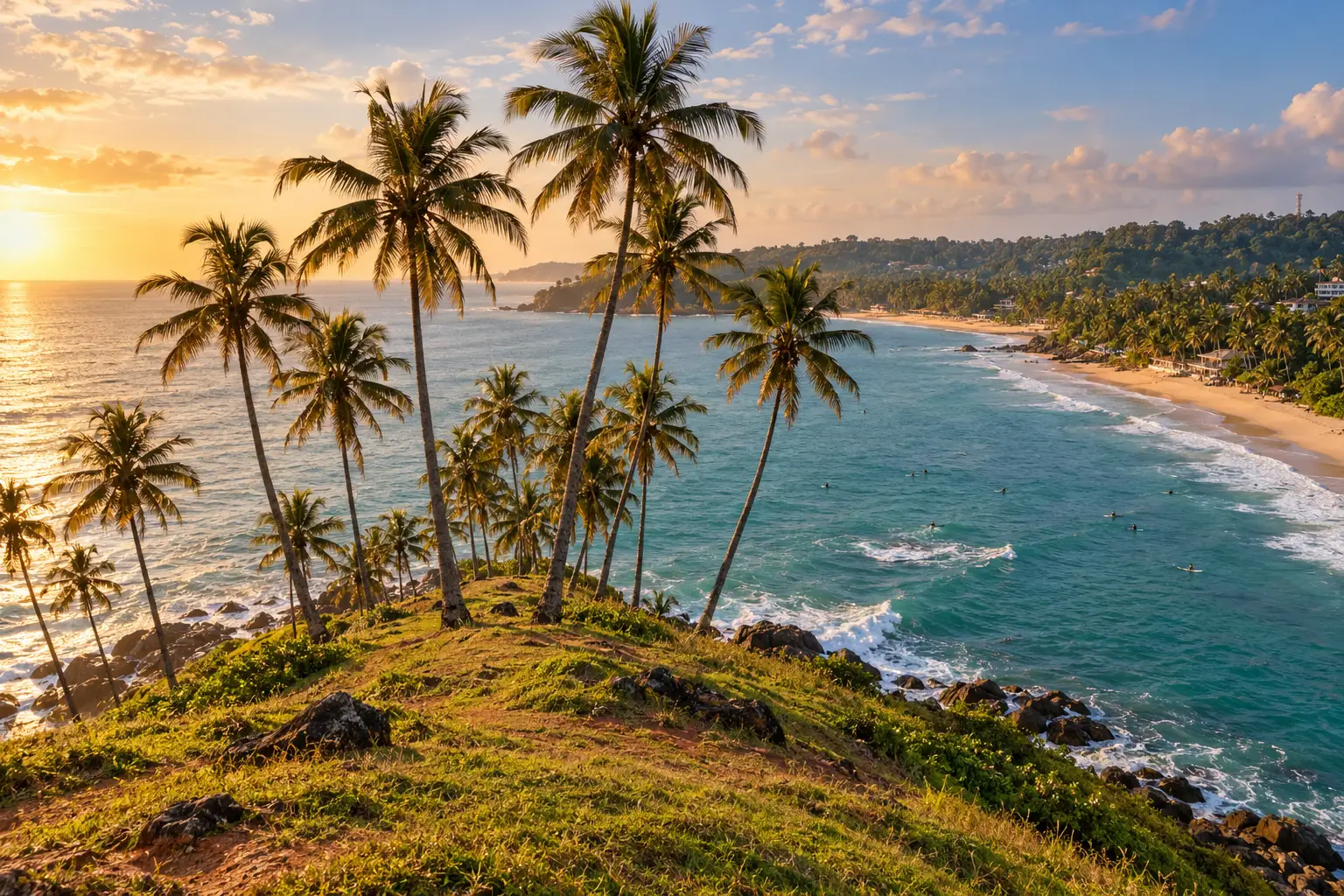 Coconut palms on Coconut Tree Hill above the turquoise bay at Mirissa